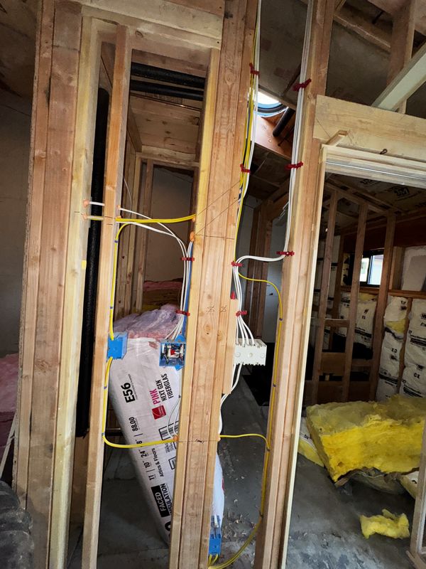 ADU interior framing with home runs trained through new partition walls