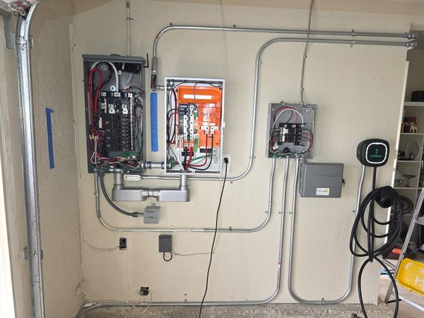 Exterior meter panel and new PV system disconnect along the side yard