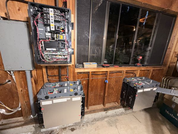 System controller wiring with IQ batteries mounted below in the garage
