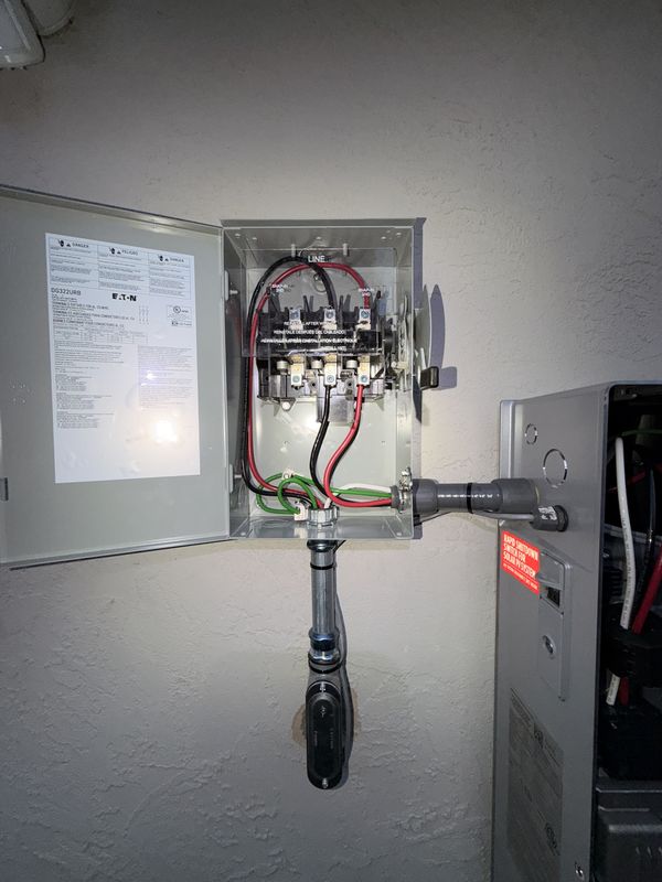 Eaton safety disconnect open showing line-side terminations and grounding