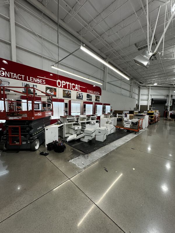Costco Gilroy Optical sales area with scissor lift and display casework during the buildout