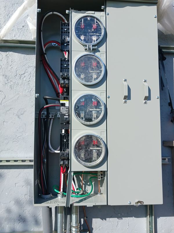 Four-position meter stack interior with main breakers for a multi-family building