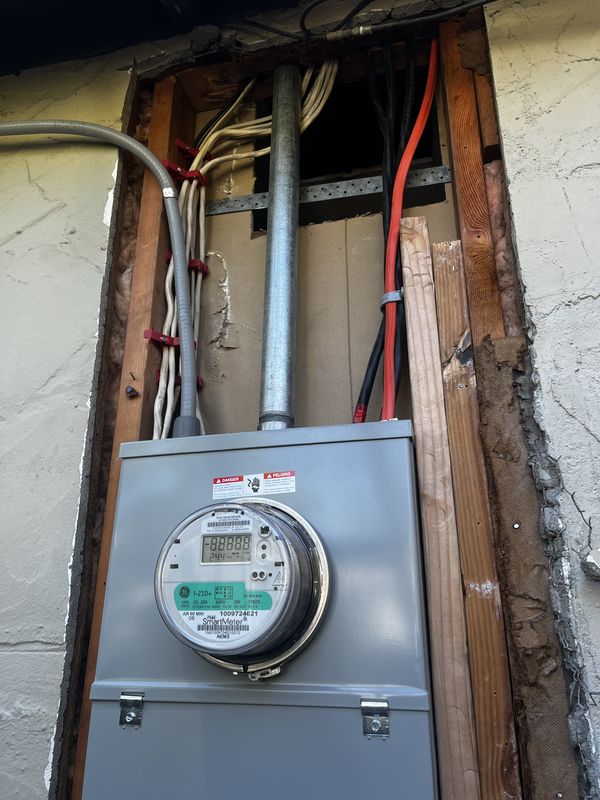 New exterior meter-main with service riser and neatly secured conductors
