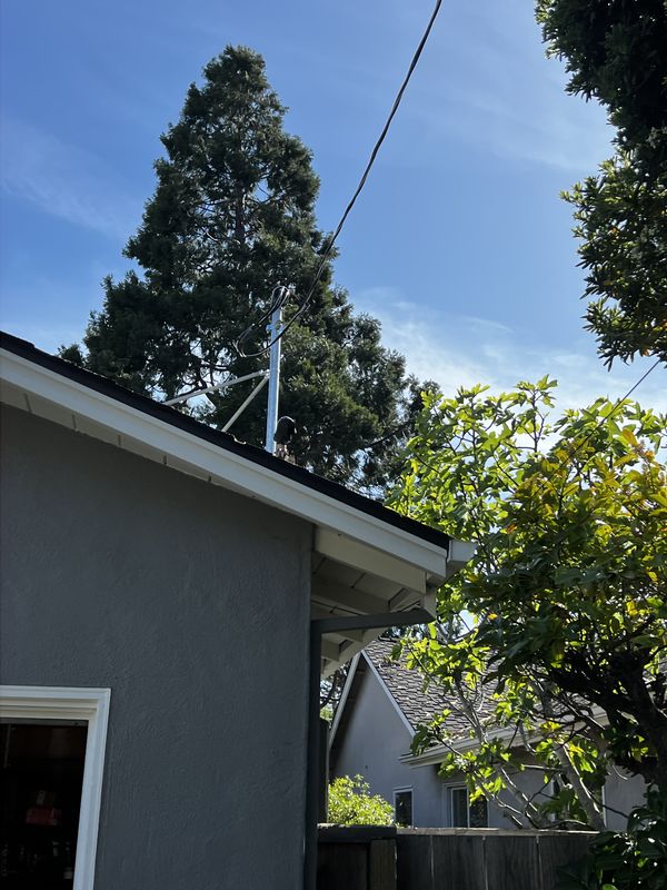 New weather head and service drop connection at the roofline