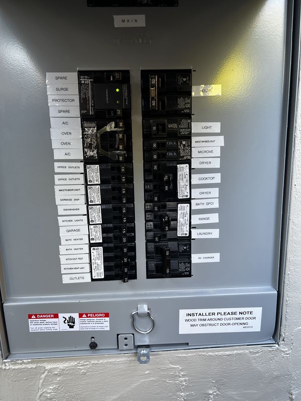 Outdoor main panel with every circuit labeled, including the EV charger