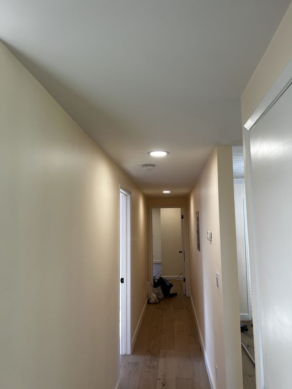 Hallway with new recessed lighting and rewired switch runs