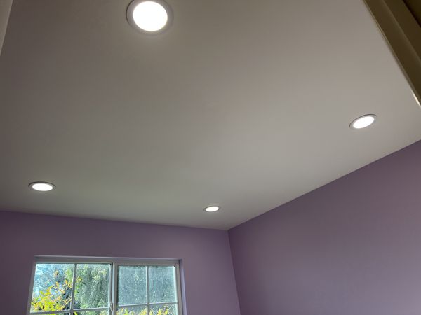 Purple bedroom with new dimmable recessed lighting installed