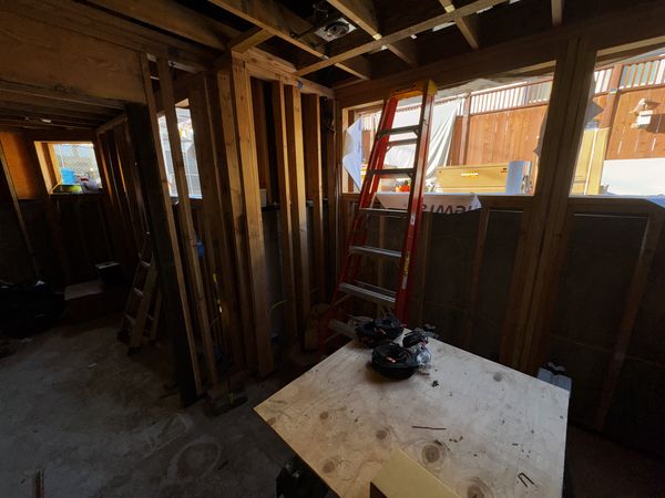 Interior framing during rough-in with work table and tools staged
