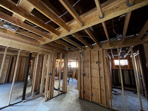 Room framing with recessed light cans and circuits pulled through joists